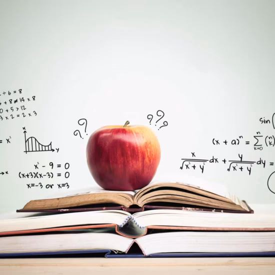 apple stack open books with education doodles copy space education concept