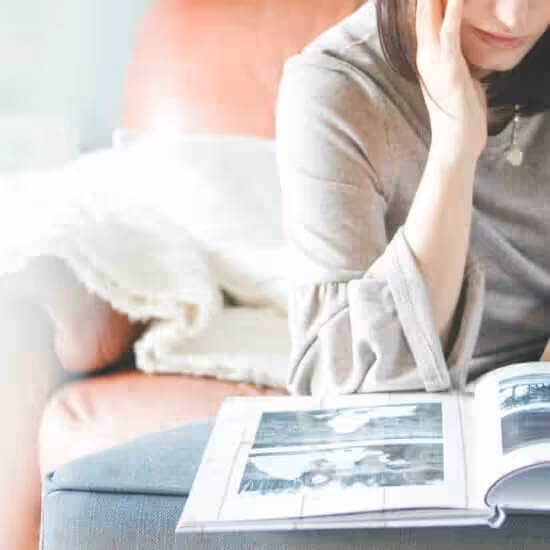 woman looking at photo album