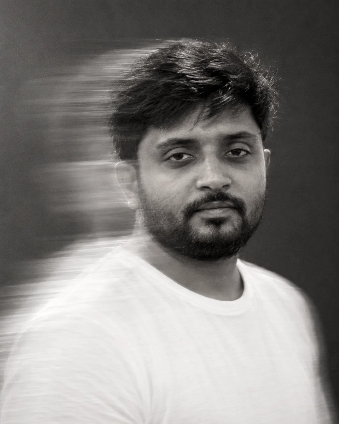 Black-and-white portrait of Gaurav Tiwari with motion blur