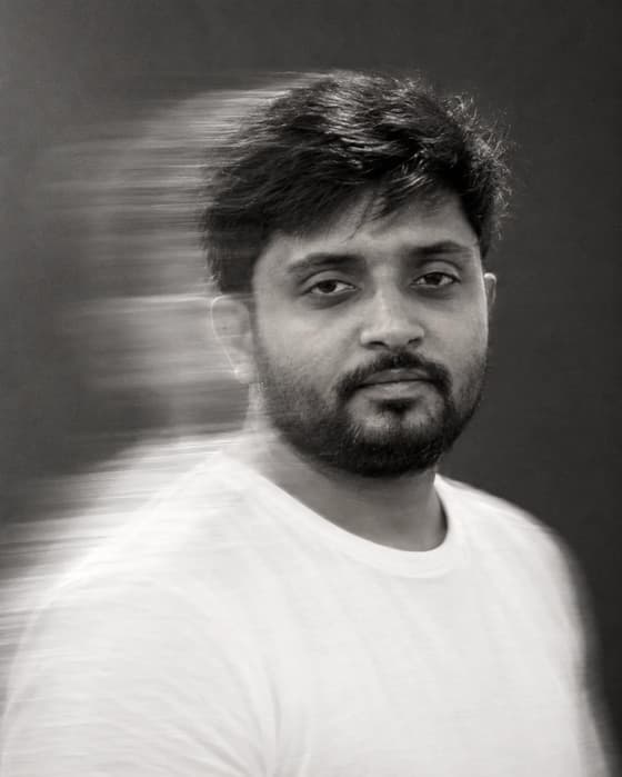 Black-and-white portrait of Gaurav Tiwari with motion blur.