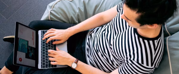 photo of man using laptop