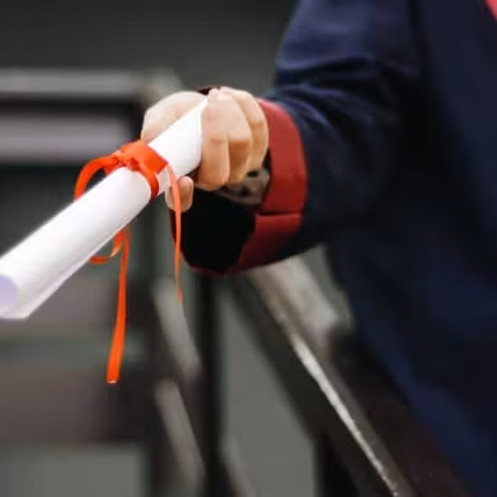 person holding white scroll