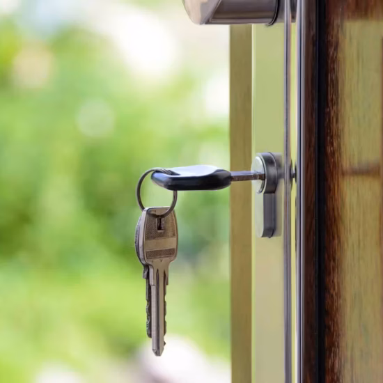 black handled key on key hole