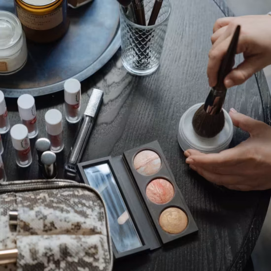 person holding brown wooden rolling pin