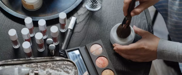 person holding brown wooden rolling pin