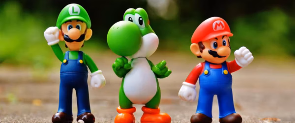 focus photo of super mario luigi and yoshi figurines