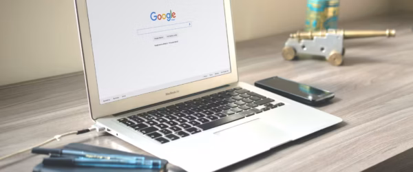 macbook air on grey wooden table
