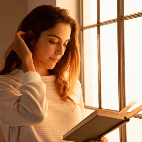 young woman reading a book