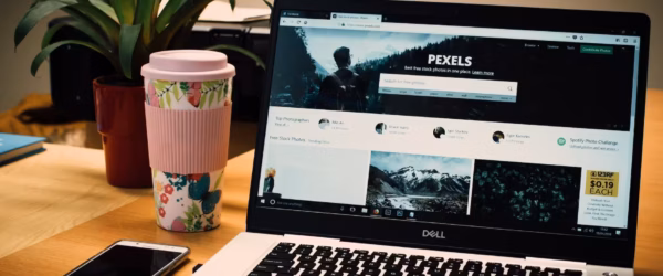 photo of a gray dell laptop displaying pexels webpage