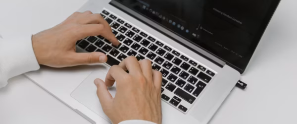 hands on a laptop keyboard