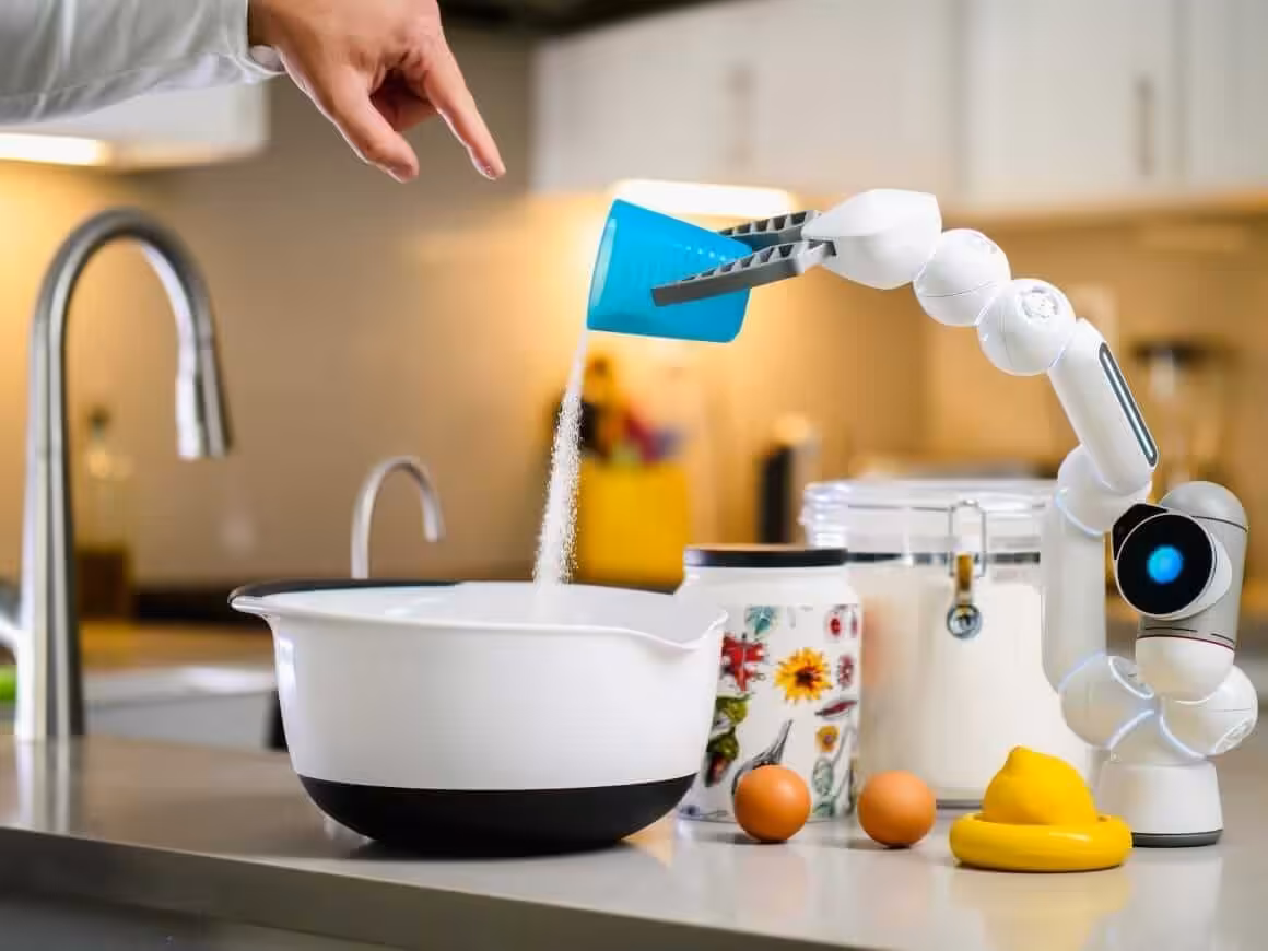 robot hand pouring flour into white bowl. Machine learning courses can empower you making these.