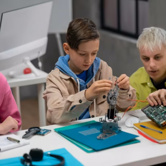 Children engaged in STEM robotics project.