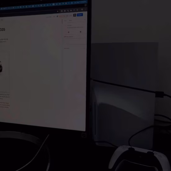 PlayStation console next to computer monitor