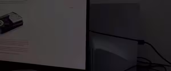 PlayStation console next to computer monitor