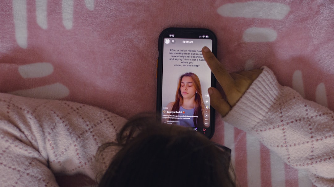 Young person on a phone watching short-form digital entertainment