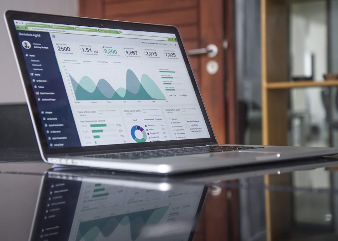 Website analytics dashboard on a laptop showing traffic and engagement charts