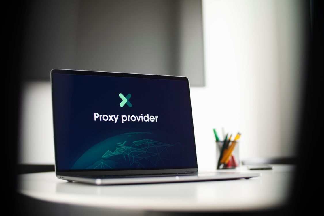 Laptop displaying a proxy provider website in an office, illustrating a tool people use to reroute online traffic