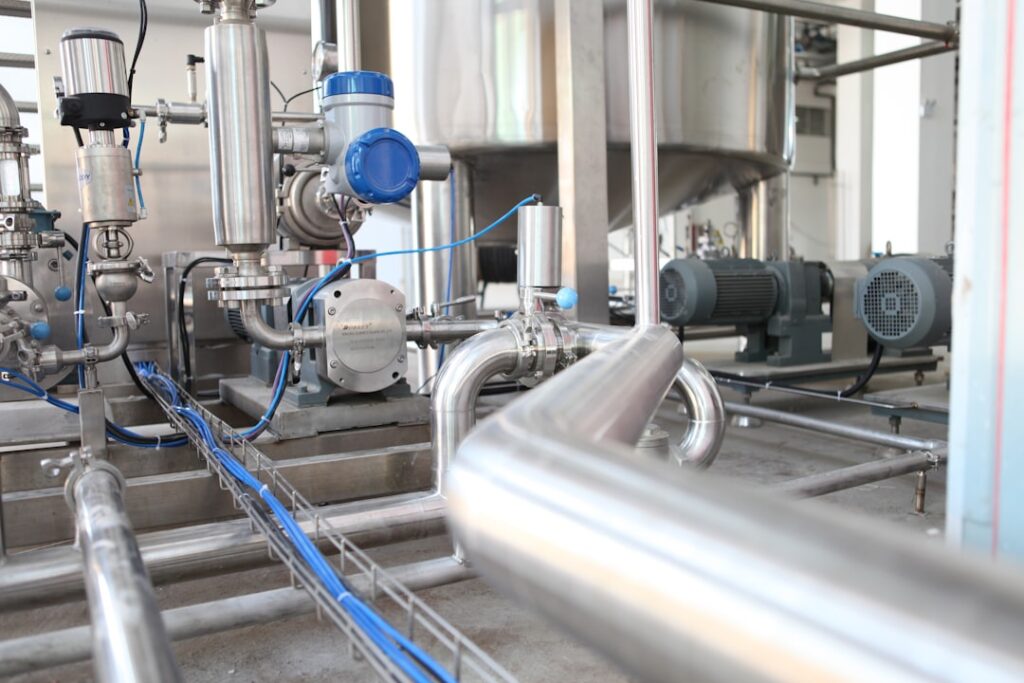 Stainless steel centrifugal pump system with process piping, motor, valves, and instrumentation