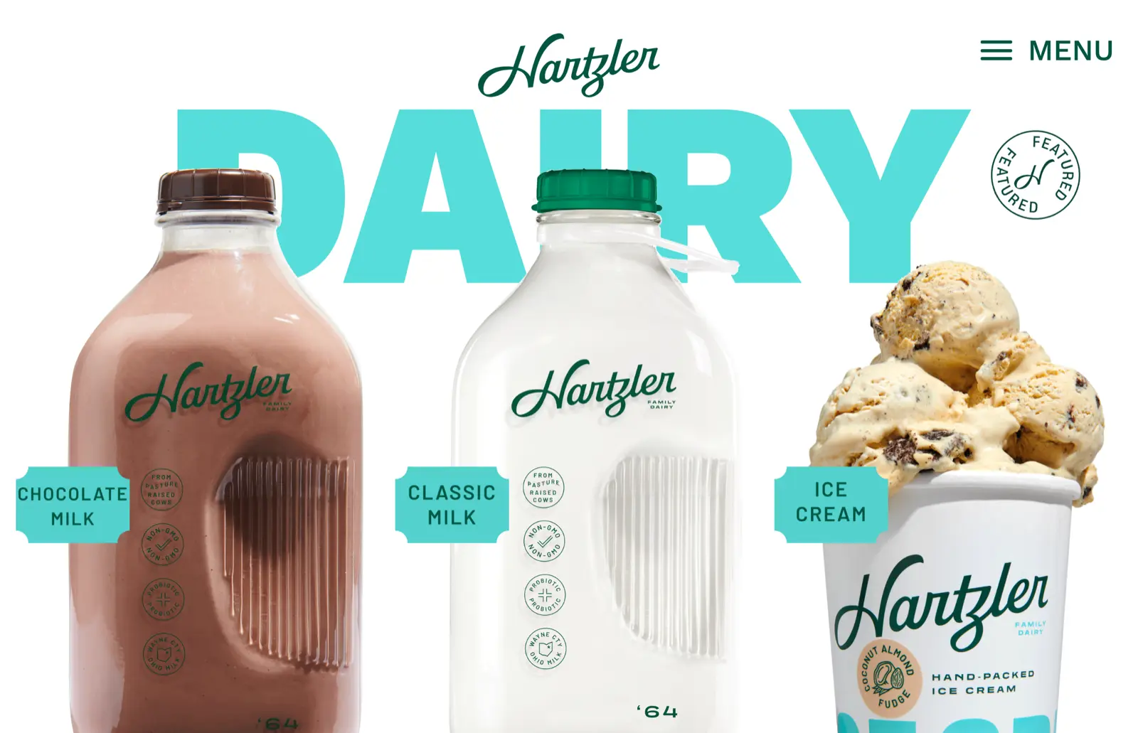 Hartzler Family Dairy homepage showing glass milk bottles and ice cream products under a large DAIRY headline