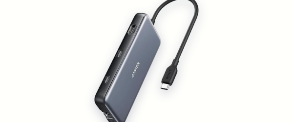 Anker 555 8-in-1 USB-C hub with its attached USB-C cable, HDMI and USB-C ports facing forward, on a warm ivory background