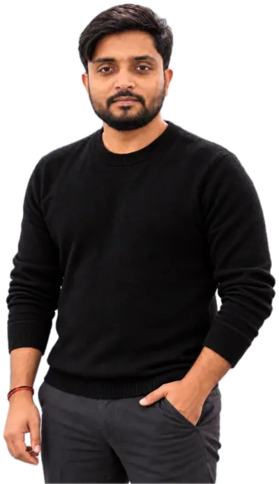 Gaurav Tiwari in a black sweater, smiling slightly, one hand in his pocket