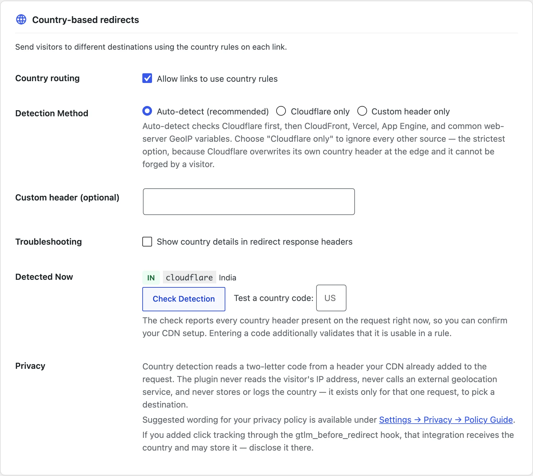 The Country-based redirects card in GT Link Manager settings with Country routing turned on and Detected Now showing a country code from Cloudflare