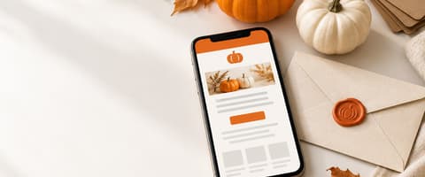 Smartphone showing an orange-accented email layout beside a pumpkin wax-sealed envelope, mini pumpkins and kraft gift tags