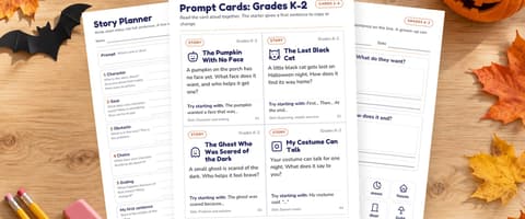 Printed Halloween story planner, grades K-2 prompt cards and a picture planner on a wooden desk with a jack-o-lantern, autumn leaves, pencils and a paper bat